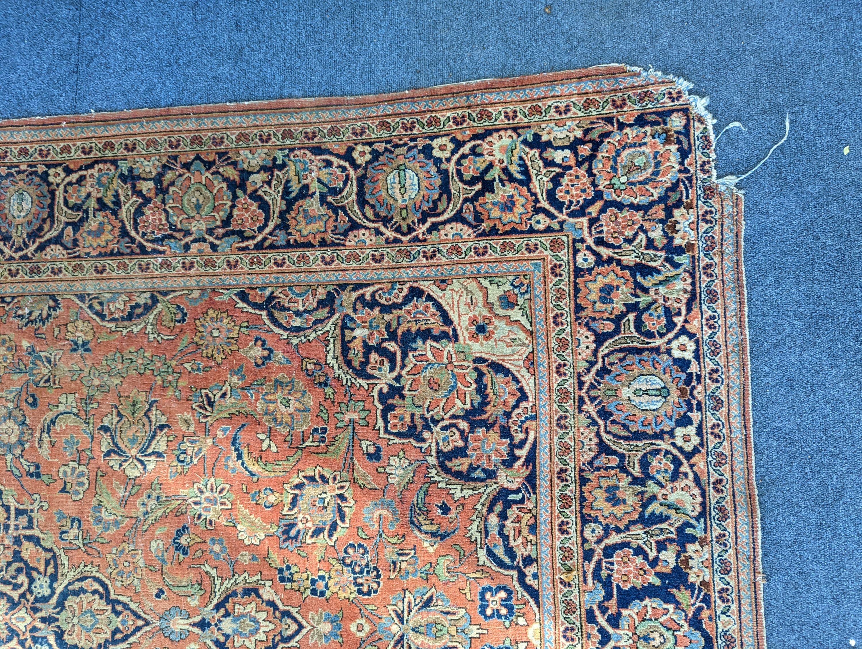 A Kashan red ground rug, 200 x 132cm